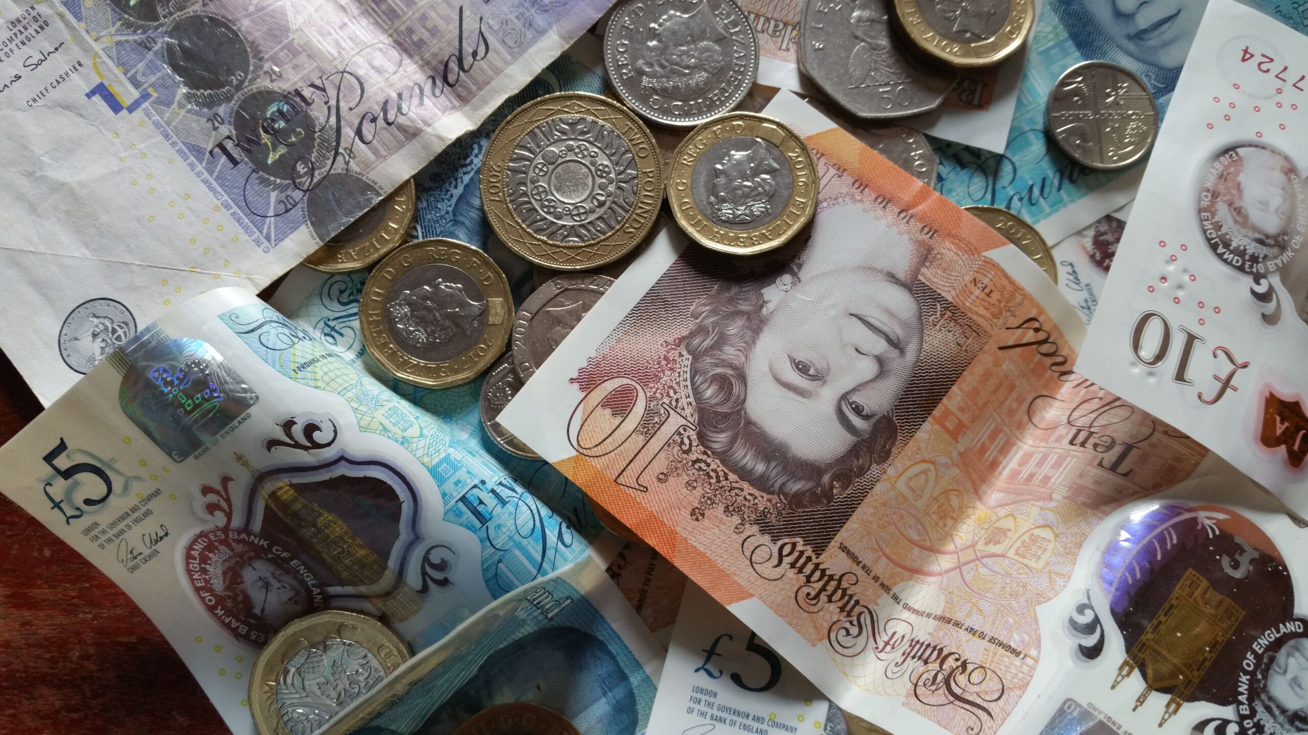 British pound coins and notes, illustrating the 1p savings challenge