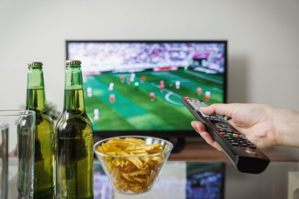 Premier League viewing costs 2026/27, TV remote and football on screen
