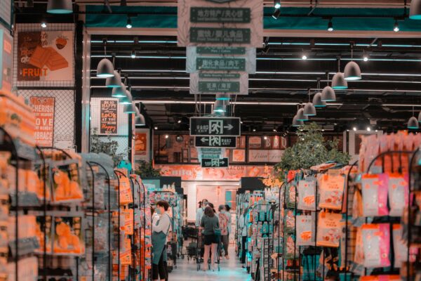 Shoppers browsing a supermarket aisle