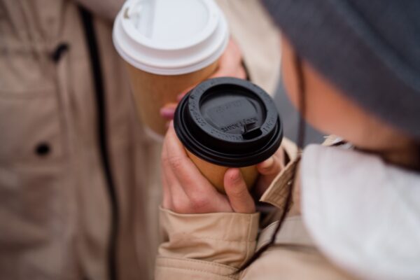 Two takeaway coffee cups, illustrating the McDonald's free coffee deal September 2026